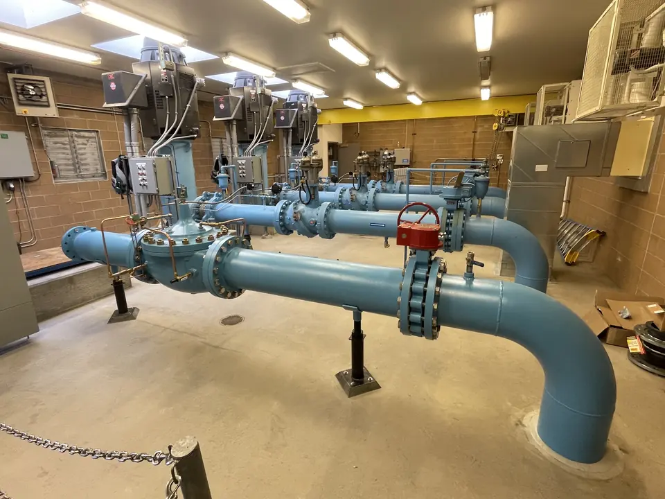 Blue process piping installed in a pump room
